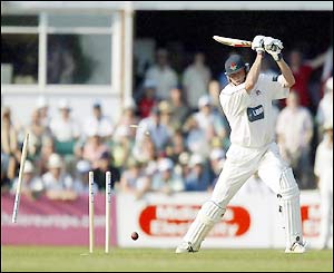 Andrew Hall bowls Peter Martin