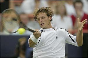 Argentina's David Nalbandian returns a serve to Germany's Rainer Schuettler during the Montreal Masters