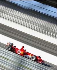 Rubens Barrichello's Ferrari powers around the Indianapolis circuit 