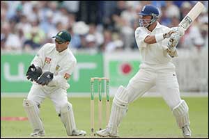 Alec Stewart hits a boundary as he past 50 and guides England past 400 runs 