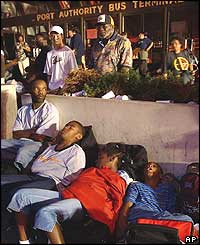 Travellers outside the Port Authority bus terminal, New York, on Friday morning