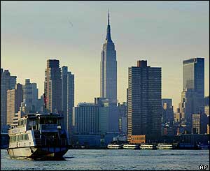 A ferry docks at Weehawkin, New Jersey, with a background of the New York skyline