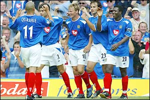 Portsmouth's Teddy Sheringham celebrates with team-mates after scoring against Aston Villa 