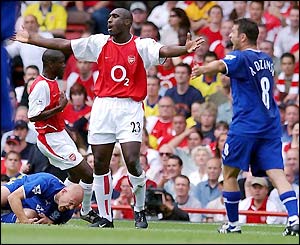 Arsenal's Sol Campbell protests his innocence after upending Everton's Thomas Gravesen