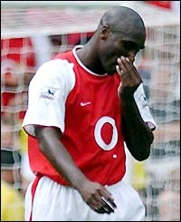 Arsenal's Sol Campbell leaves the field after being dismissed