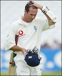 Michael Vaughan walks back to the pavilion after being dismissed by Pollock
