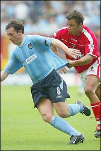 Robbie Fowler is fouled by Mark Fish