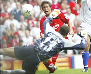 Harry Kewell watches his shot go across the face of goal