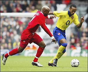 Arsenal's Thierry Henry fights his way past Liverpool's El-Hadji Diouf