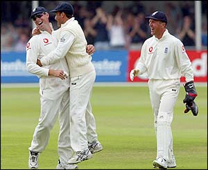 Marcus Trescothick is congratulated by his team-mates after catching an edge from Andrew Hall