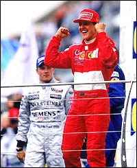 Michael Schumacher celebrates winning the US Grand Prix in September