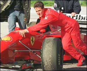Michael Schumacher pushes his Ferrari towards the pits in 1996