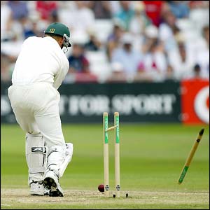 South Africa's Shaun Pollock is bowled by England's Andrew Flintoff