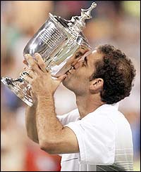 Pete Sampras kisses the US Open trophy