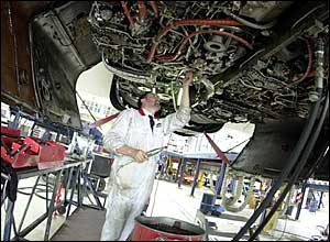 Engineers at work on a BA Concorde at its Heathrow base