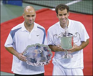 Andre Agassi poses with Pete Sampras after the 2002 US Open final