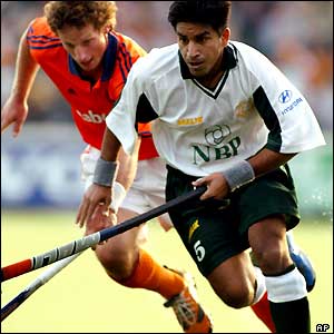 Ronald Brouwer of the Netherlands duels for the ball with Waseem Ahmad of Pakistan during their match at the Champions Trophy