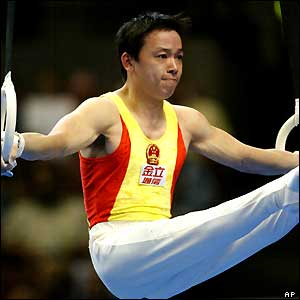 China's Xu Huang performs his routine on the rings during men's team finals at the World Gymnastics Championships