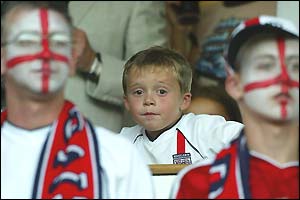 Brooklyn Beckham watches his dad lead the England side out at Portman Road