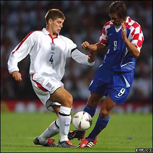 Steven Gerrard wins the ball in a tackle with Marijo Maric of Croatia