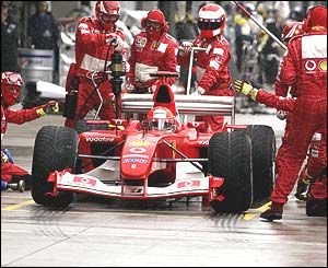 Michael Schumacher leaves the pits after a stop during the US Grand Prix