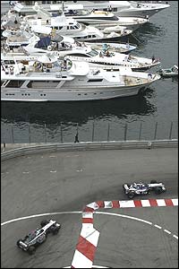 Juan Pablo Montoya leads Kimi Raikkonen around Monaco's harbour-front chicane