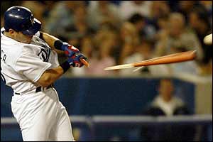 Paul Lo Duca of the Los Angeles Dodgers breaks his bat on a foul ball against the New York Mets at Dodgers Stadium 