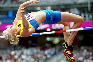 Carolina Kluft clears the high jump at 1.94m