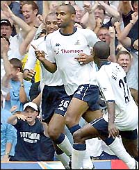 Kanoute celebrates as he scores the winning goal