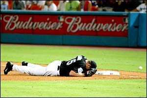 Florida Marlins pitcher Mark Redman lies injured during the third game of the National League Championship series against the Chicago Cubs
