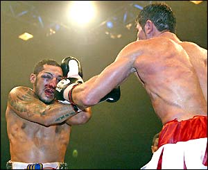 Italian Silvio Branco lands a left on the battered Frenchman Mehdi Sahnoune