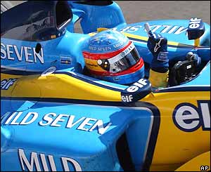 Alonso celebrates his win as he becomes the youngest ever winner in F1