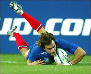 Christophe Dominici scores his second try of the match
