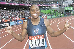 Kelli White celebrates her win in the 100m