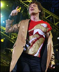 Rolling Stones lead singer Mick Jagger bounds around the stage 