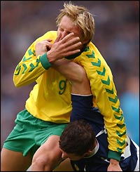 Lithuania (left) and Scotland do battle