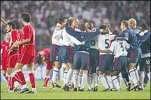 England celebrate their draw with Turkey