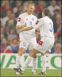 Serbia & Montenegro's scores Zvomimir Vukic against Wales