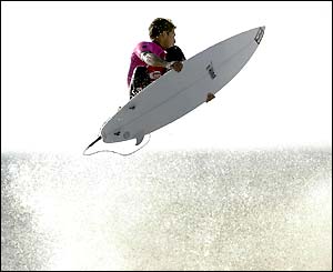 Hawaiian Andy Irons leaps high on his surf board