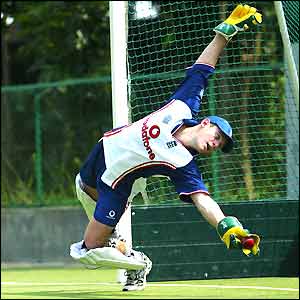 England's new Test wicket-keeper Chris Read takes an acrobatic catch in training
