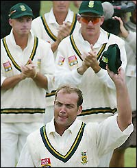 Kallis is clapped off after ending England's hopes in the fourth Test