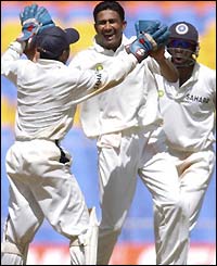 India's Anil Kumble celebrates taking the wicket of Lou Vincent