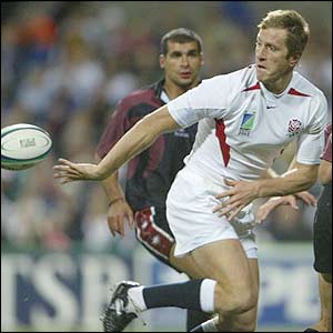 Will Greenwood sets up Engloand's seventh try as he offloads the ball to Mark Regan