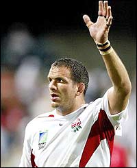Captain Martin Johnson acknowledges the England supporters after his team'S WIN