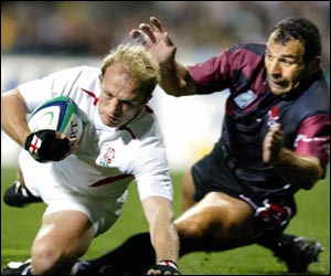 Matt Dawson gets a away from a Georgian defender to score a try