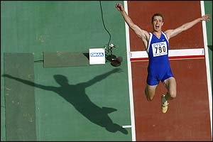 Dmitry Karpov of Kazakhstan takes first place in Group A with a jump of 7.75m