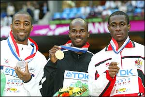 Darren Campbell (bronze), Kim Collins (gold) and Darrel Brown (silver) on the winners' podium