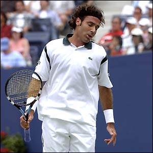 Spain's Alex Corretja has no answer to Agassi's awesome shots as the world number one loses just five games in an emphatic win