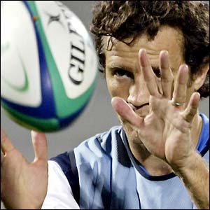 France's Fabien Galthie concentrates on the ball in a training session at the Rugby World Cup