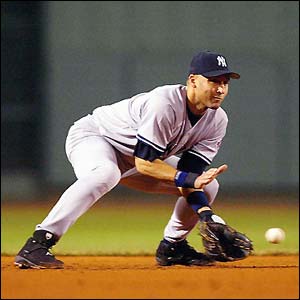 Derek Jeter of the New York Yankees fields the ball during their 3-2 to loss to the Boston Red Sox 